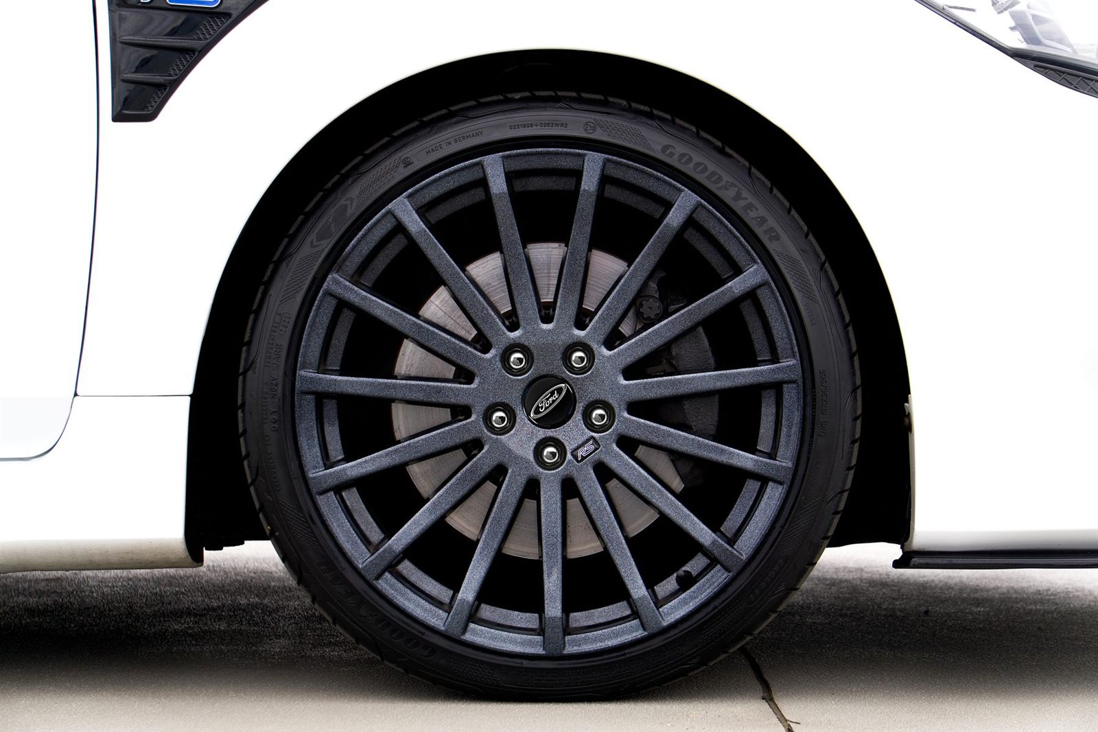 Clean dark multi-spoke alloy wheel after a complete finish refresh